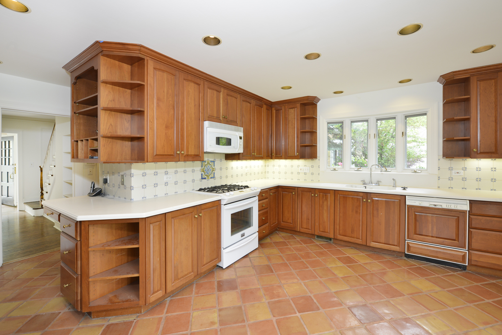 82 Warwick Road Winnetka, IL 60093 - Photo 11 of 24 a kitchen with stainless steel appliances a sink and cabinets
