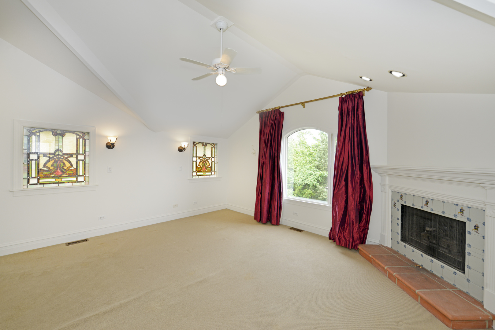 82 Warwick Road Winnetka, IL 60093 - Photo 15 of 24 a view of a bedroom with a bed and a fireplace