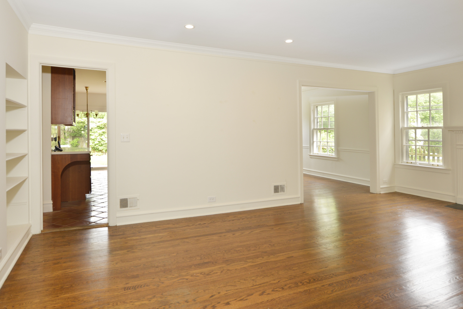 82 Warwick Road Winnetka, IL 60093 - Photo 6 of 24 an empty room with wooden floor and windows