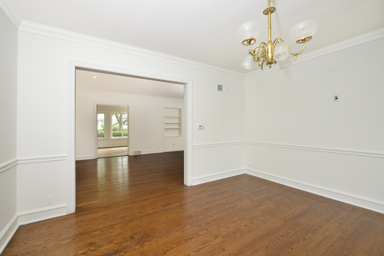 82 Warwick Road Winnetka, IL 60093 - Photo 8 of 24 a view of empty room with wooden floor