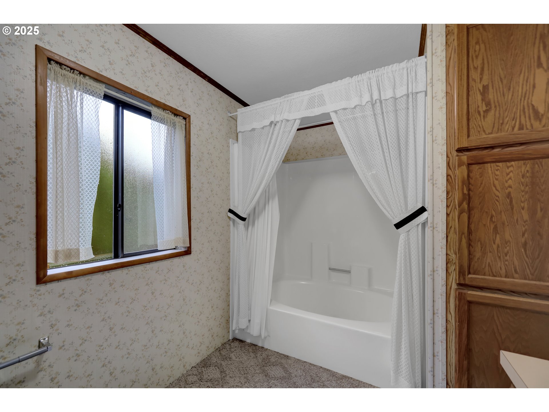 1199 North Terry Street, Unit 366 Eugene, OR 97402 - Photo 15 of 32 a bathroom with a bathtub and a shower