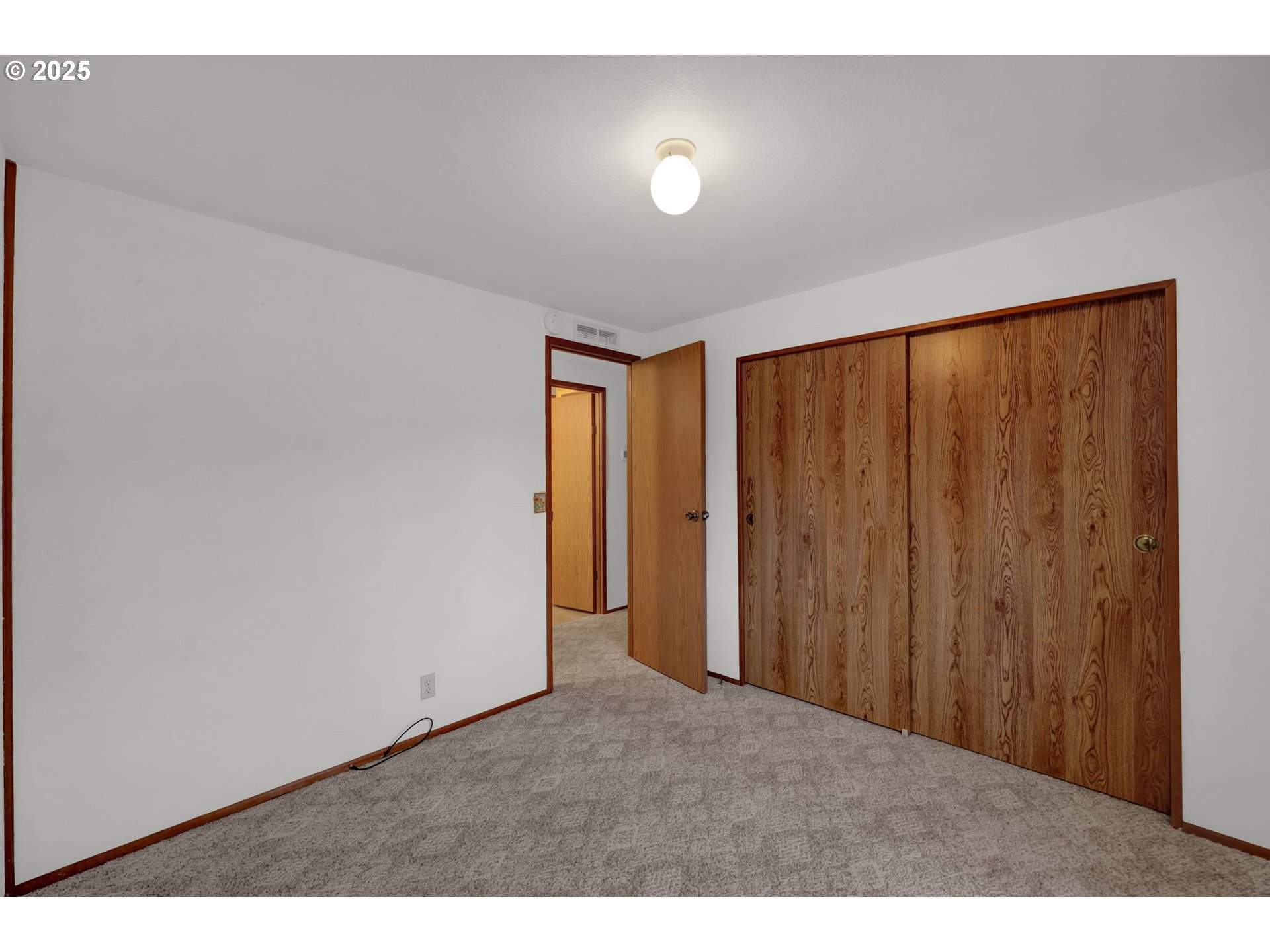 1199 North Terry Street, Unit 366 Eugene, OR 97402 - Photo 17 of 32 a view of an empty room with a window