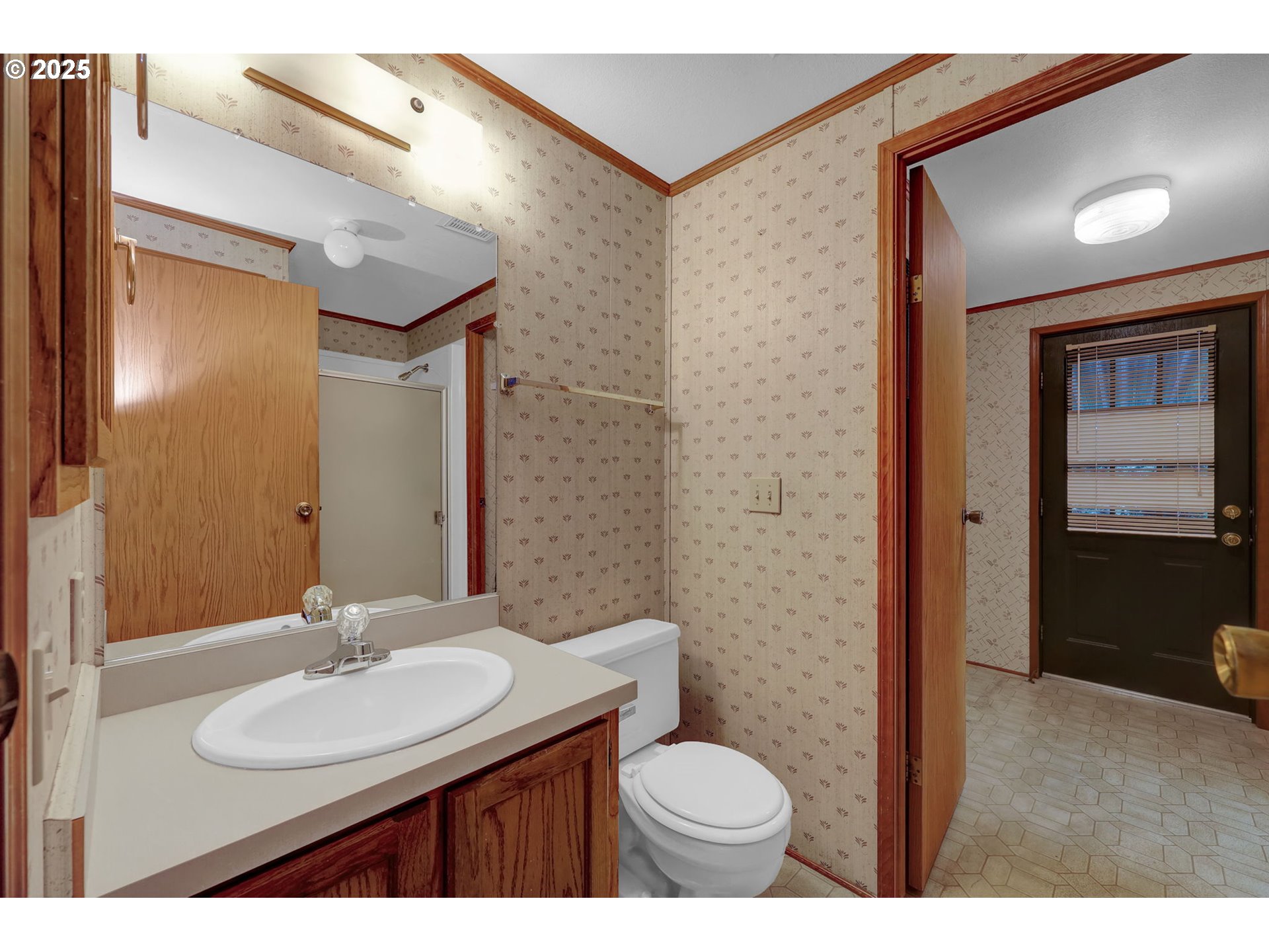 1199 North Terry Street, Unit 366 Eugene, OR 97402 - Photo 21 of 32 a bathroom with a sink and a mirror