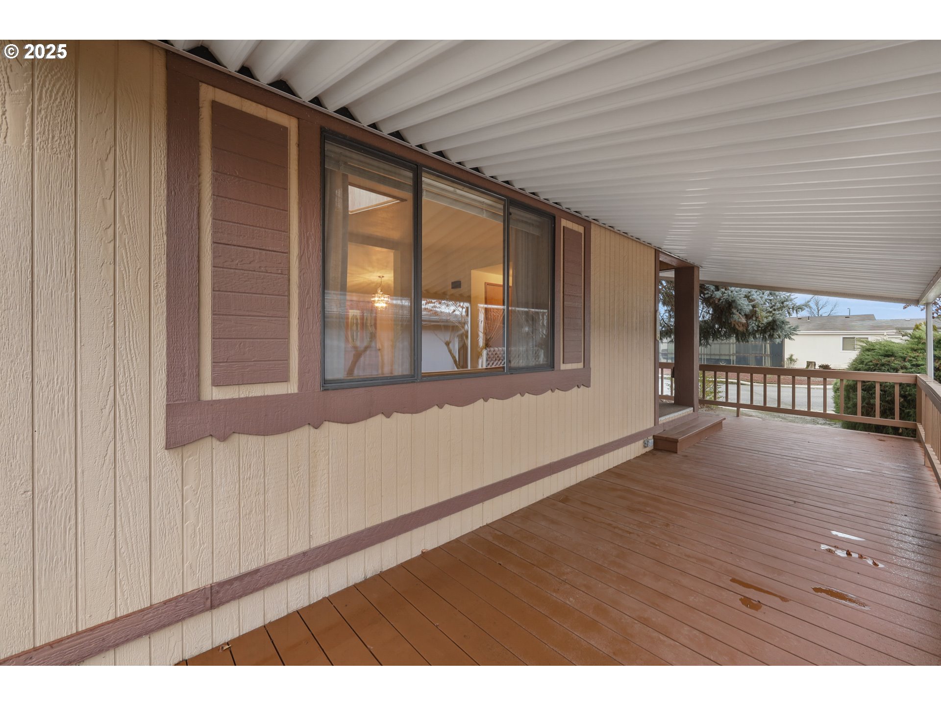 1199 North Terry Street, Unit 366 Eugene, OR 97402 - Photo 23 of 32 a view of an empty room with wooden floor and a window
