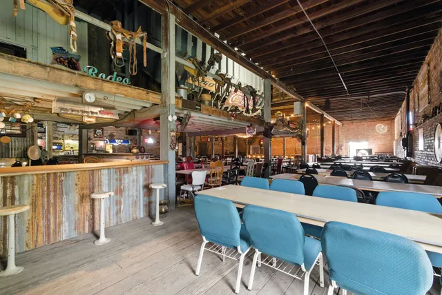 a view of a lake with table and chairs