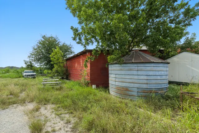 a backyard of a house with lots of green space