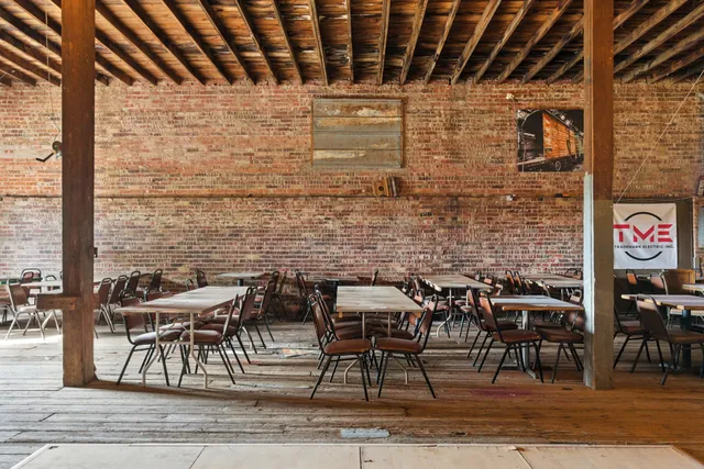 a view of a cafe with sitting area