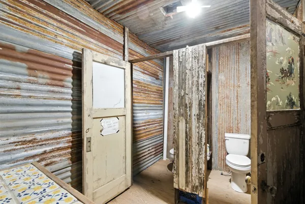 a view of a hall with wooden floor