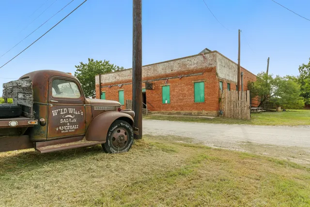 a room with wooden furniture and pool table