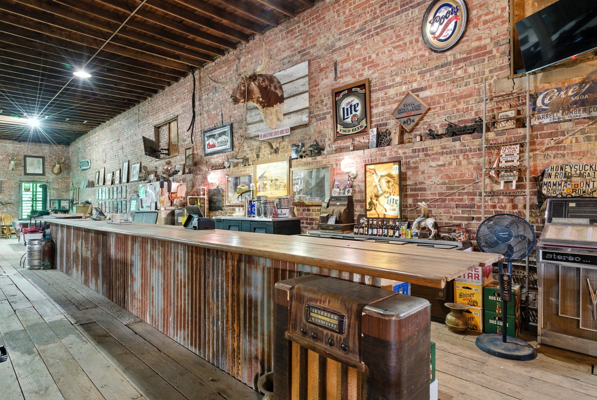 438 Melvin Street Ranger, TX 76470 - Photo 44 of 44 a kitchen with stainless steel appliances granite countertop a sink and wooden cabinets