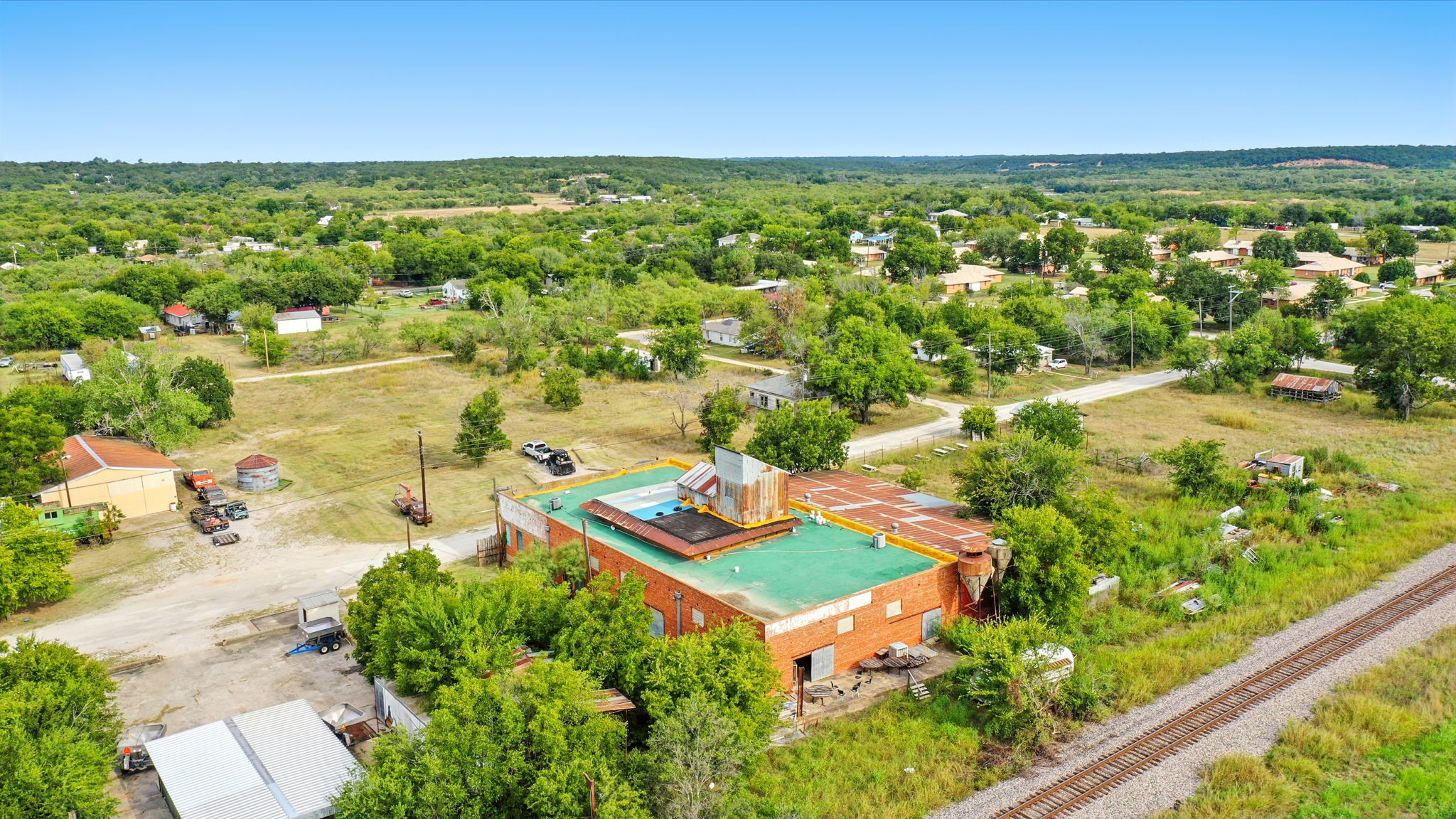 438 Melvin Street Ranger, TX 76470 - Photo 5 of 44 an aerial view of residential houses with outdoor space and trees