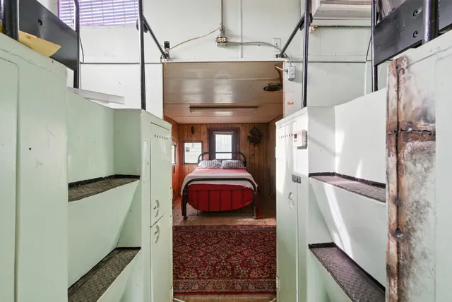 a blue and white car parked in a parking