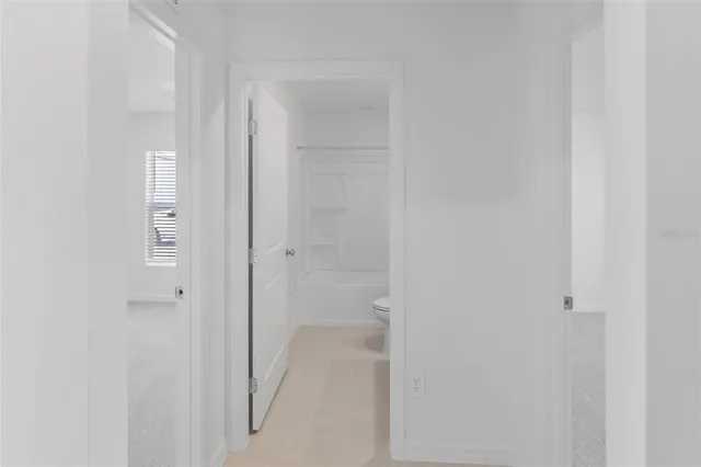 a view of a room that has a window in it