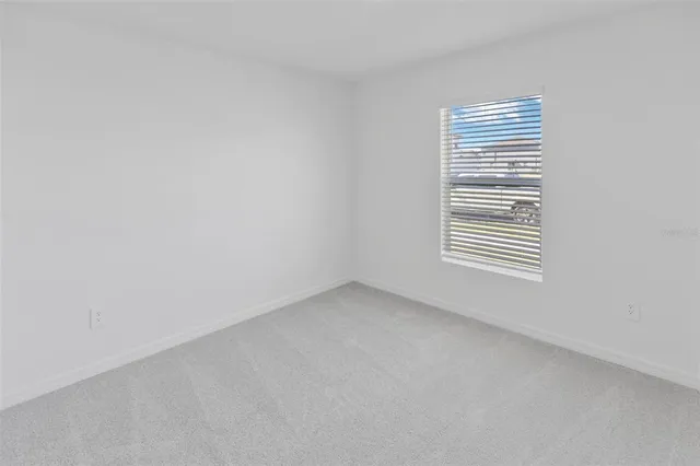 a view of a hallway with a white walls