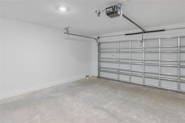 a view of swimming pool with a table and chairs