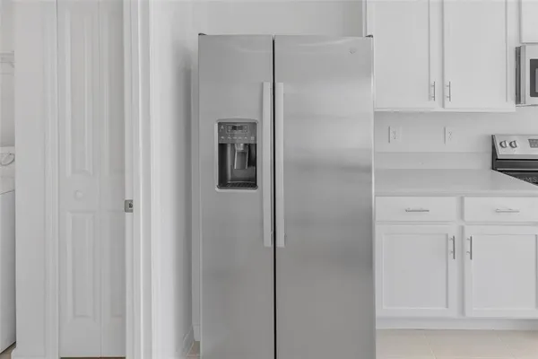 a view of cabinets and wooden floor
