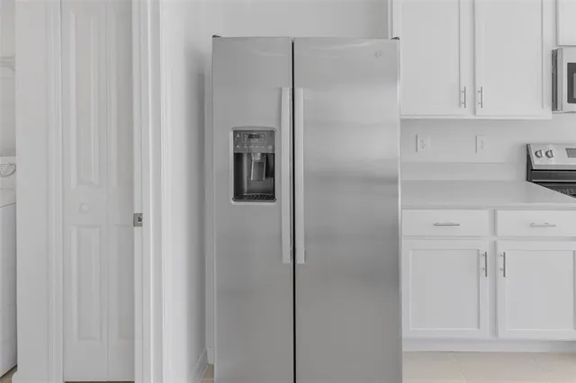a view of cabinets and wooden floor