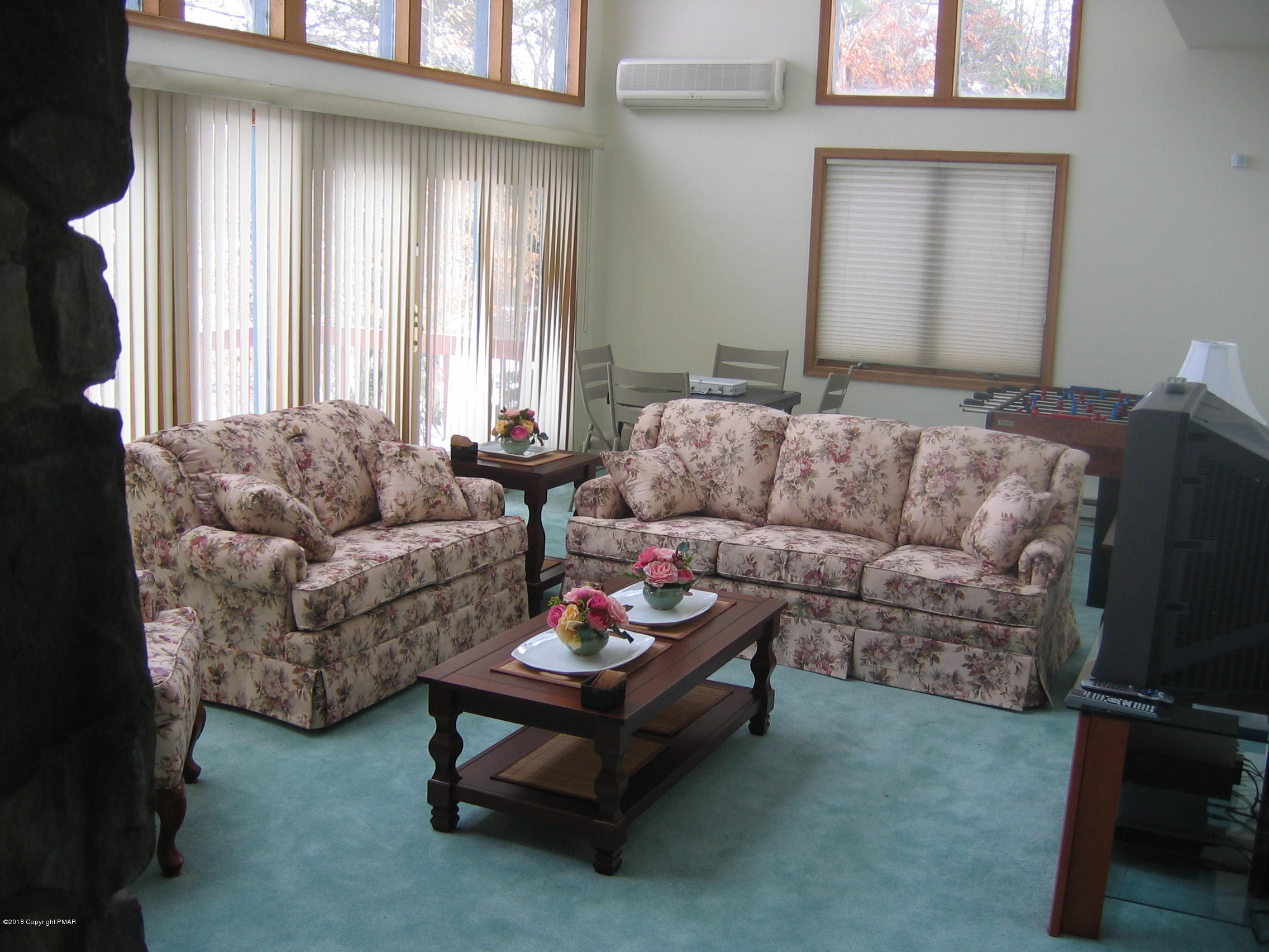 118 Lidio Road Blakeslee, PA 18610 - Photo 2 of 19 a living room with furniture and a large window