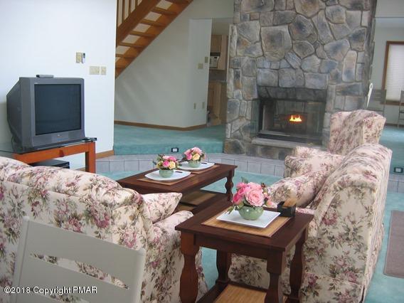 118 Lidio Road Blakeslee, PA 18610 - Photo 4 of 19 a living room with furniture and a fireplace