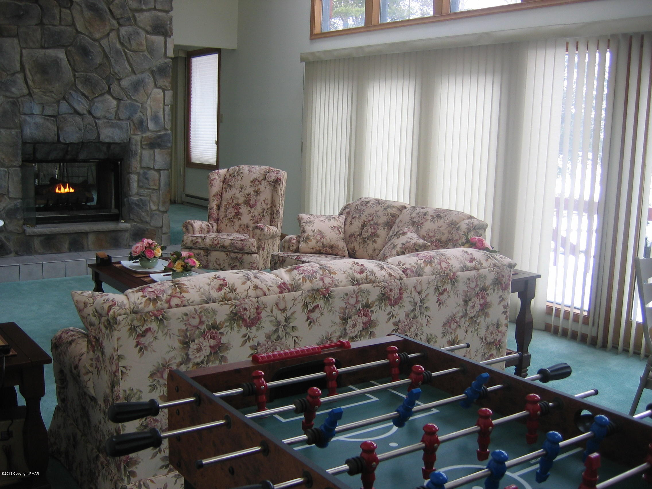 118 Lidio Road Blakeslee, PA 18610 - Photo 5 of 19 a living room with furniture and a fireplace