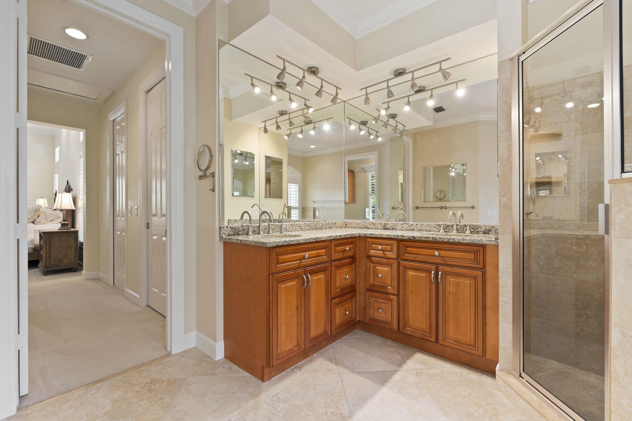 4 Castle Hill Way Stuart, FL 34996 - Photo 24 of 52 a bathroom with a granite countertop sink mirror and shower