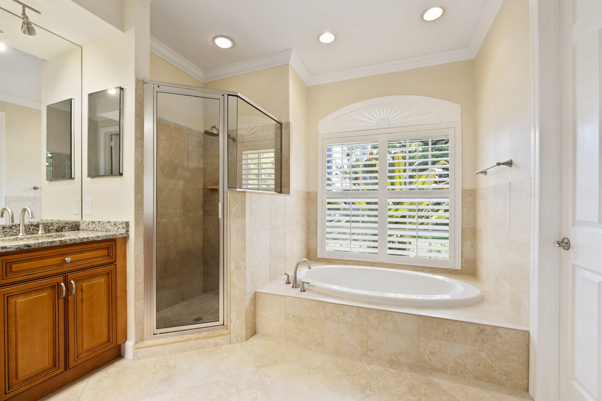 4 Castle Hill Way Stuart, FL 34996 - Photo 29 of 52 a bathroom with a granite countertop tub shower and sink