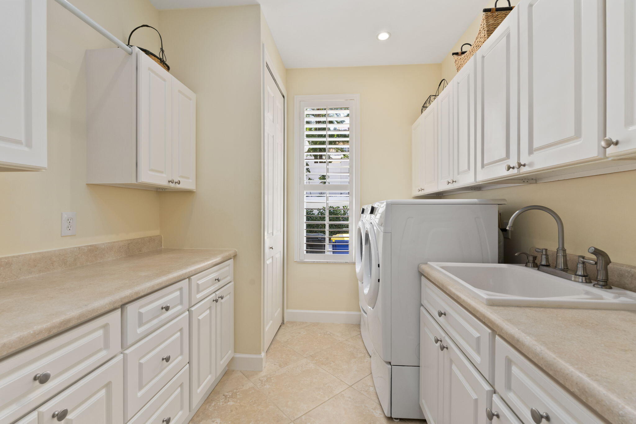 4 Castle Hill Way Stuart, FL 34996 - Photo 32 of 52 a kitchen with cabinets appliances and a sink