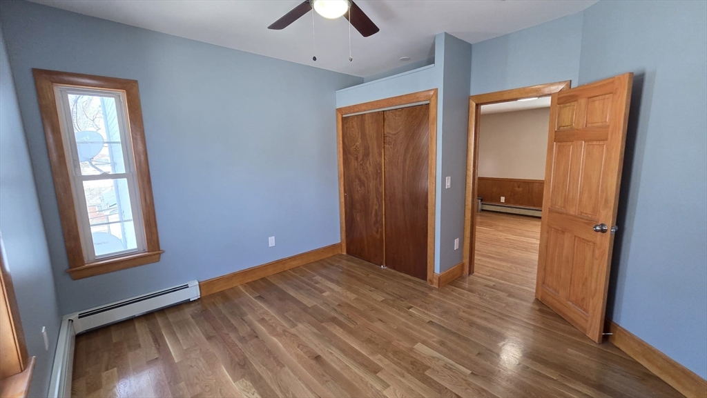 63 Carroll Street, Unit 2 Chelsea, MA 02150 - Photo 11 of 19 an empty room with closet and a window