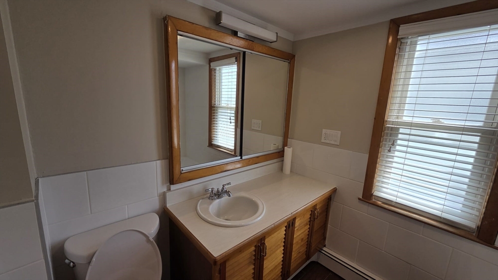 63 Carroll Street, Unit 2 Chelsea, MA 02150 - Photo 15 of 19 a bathroom with a sink and a mirror