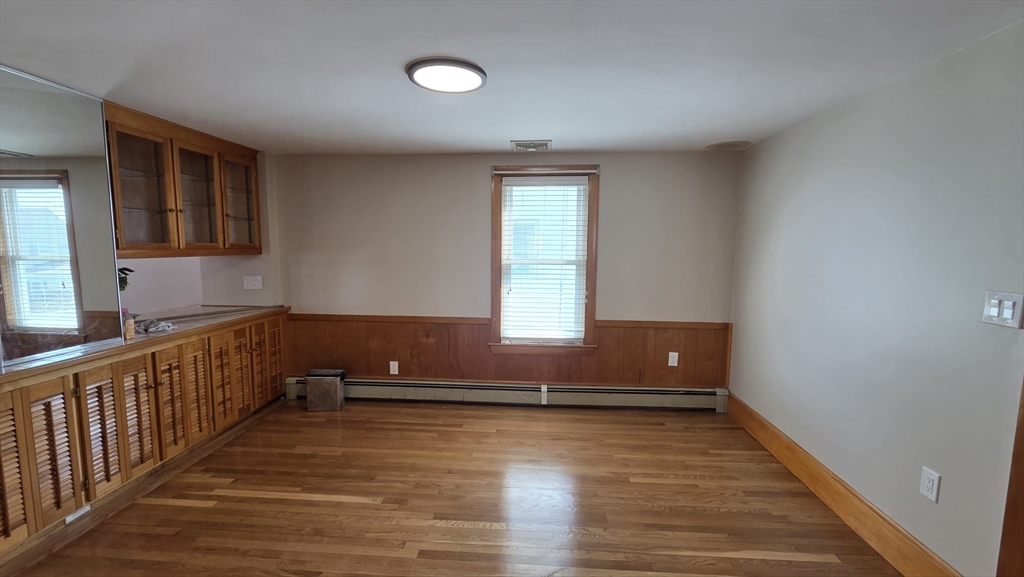 63 Carroll Street, Unit 2 Chelsea, MA 02150 - Photo 18 of 19 a view of wooden floor and window in a room