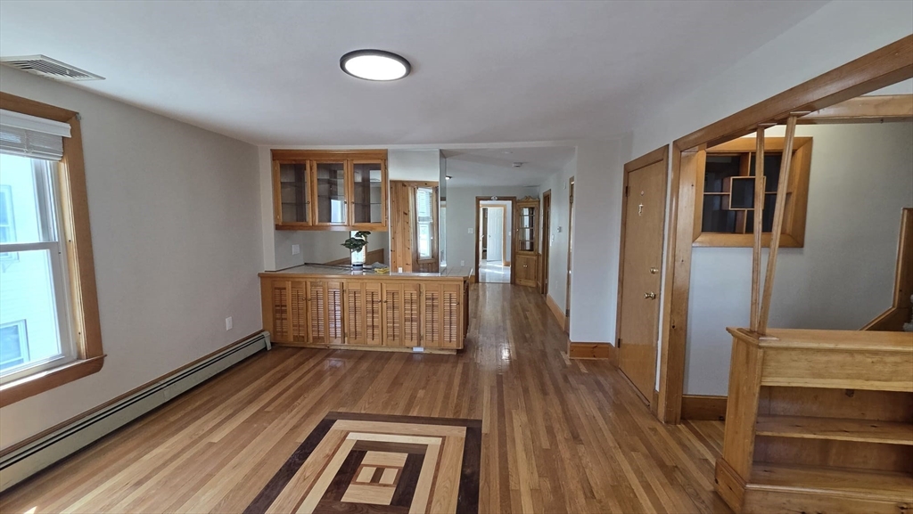 63 Carroll Street, Unit 2 Chelsea, MA 02150 - Photo 2 of 19 a bedroom with furniture and windows