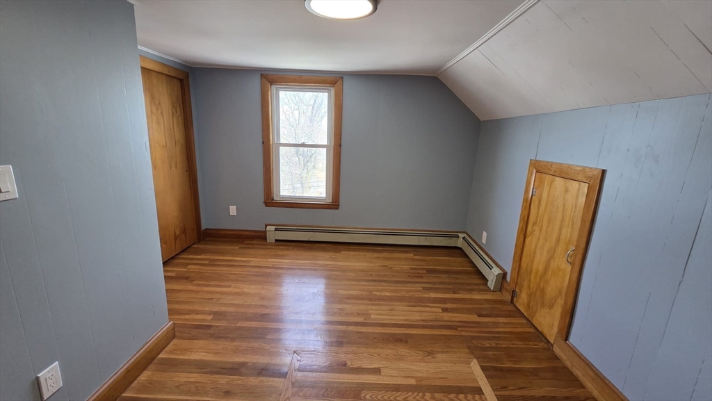 63 Carroll Street, Unit 2 Chelsea, MA 02150 - Photo 5 of 19 a view of a room with wooden floor and window
