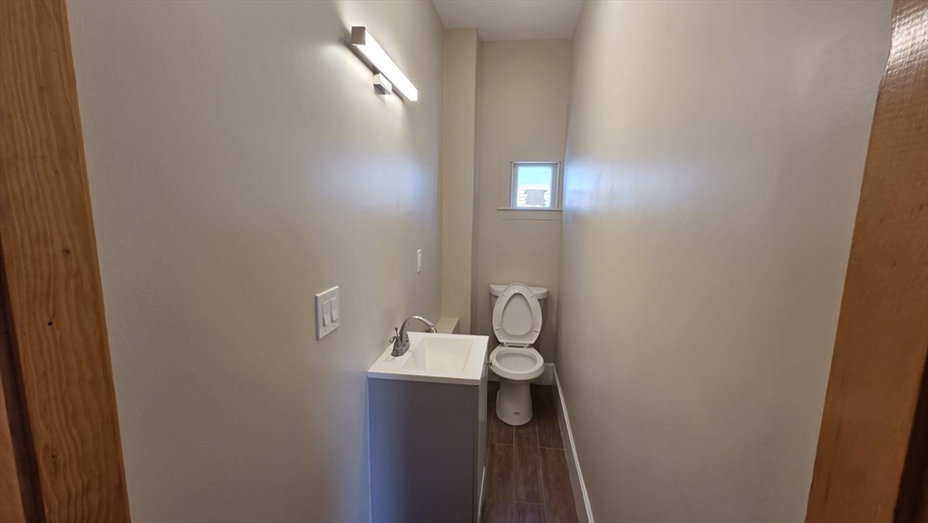 63 Carroll Street, Unit 2 Chelsea, MA 02150 - Photo 10 of 19 a bathroom with a toilet and a sink