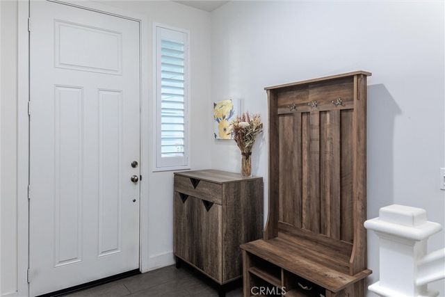 a view of a hallway with entryway door