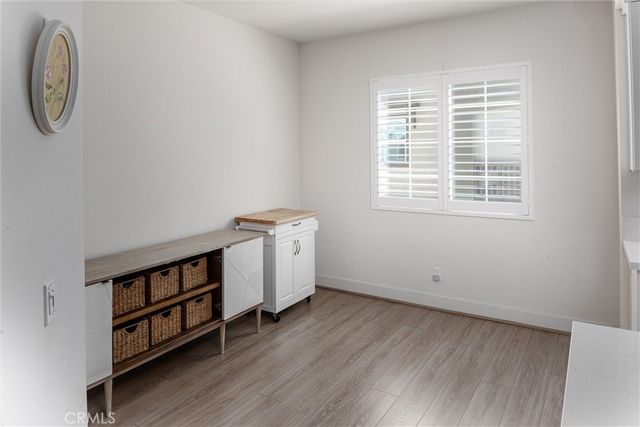 a view of a room with window and wooden floor