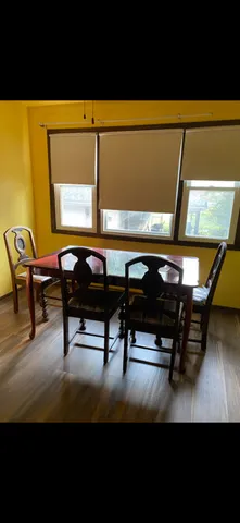 a view of a patio with table and chairs with wooden floor
