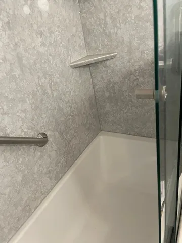 a view of a bath tub sitting in a bathroom