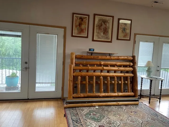 a view of wooden door with a chair