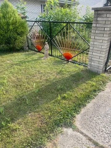 a view of garden with a bench