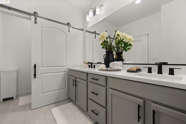 a bedroom with a bed and a desk