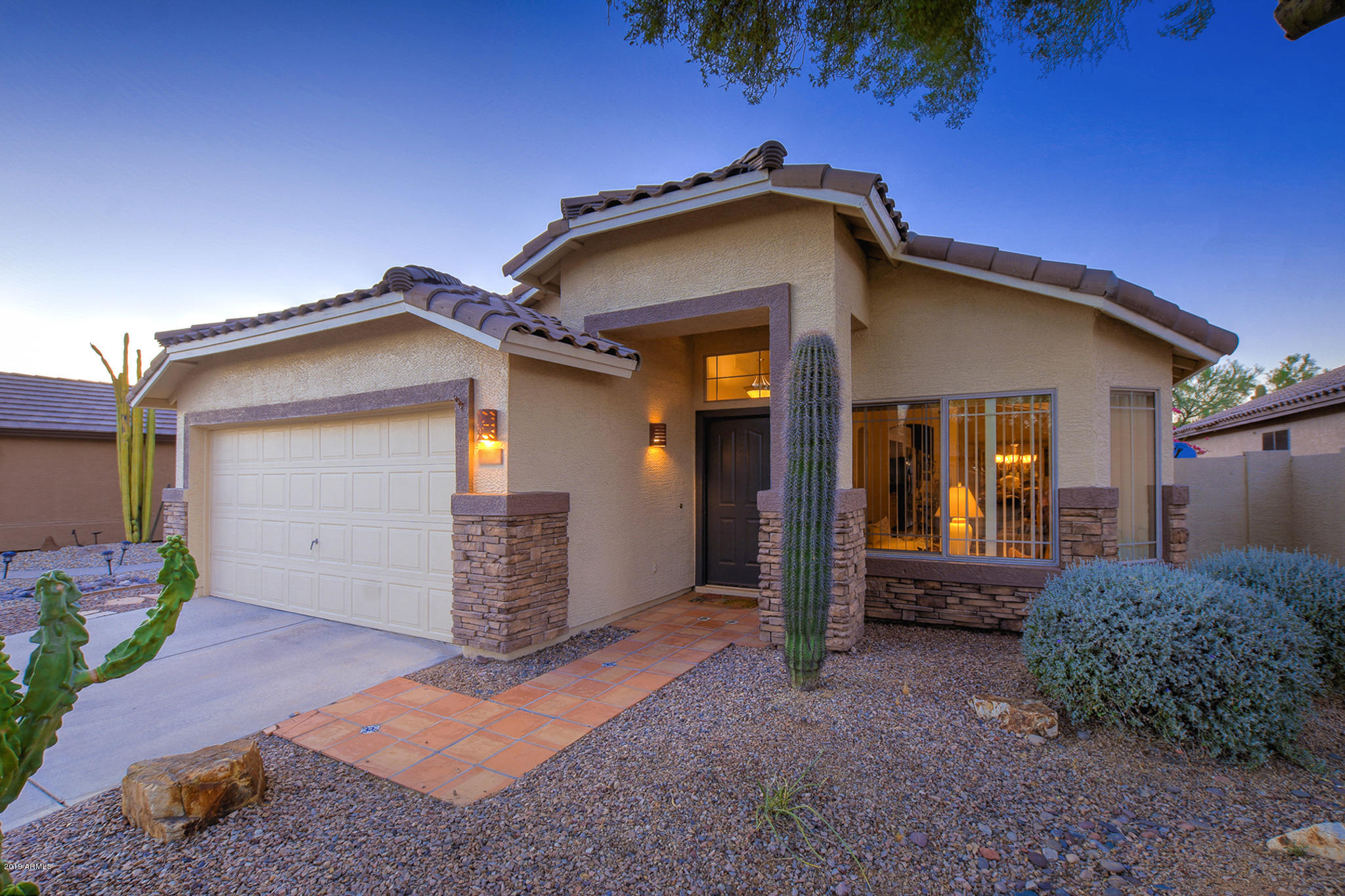 4404 East Rowel Road Phoenix, AZ 85050 - Photo 1 of 15 a front view of a house with garden