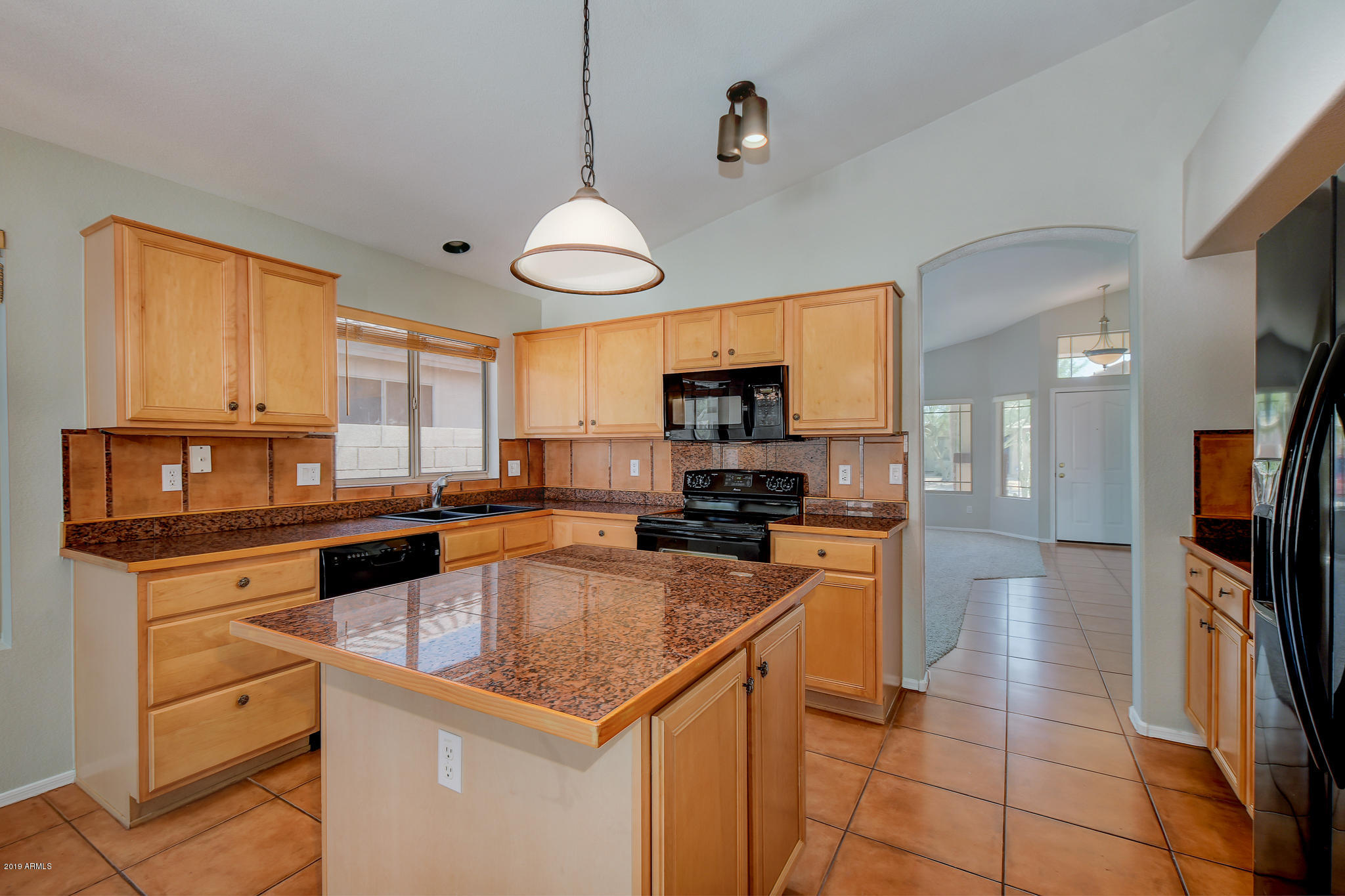 4404 East Rowel Road Phoenix, AZ 85050 - Photo 6 of 15 a kitchen with a refrigerator a sink and a stove