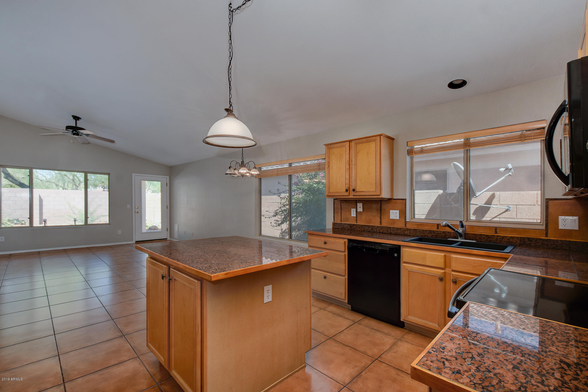 4404 East Rowel Road Phoenix, AZ 85050 - Photo 7 of 15 a kitchen with granite countertop a sink and a stove