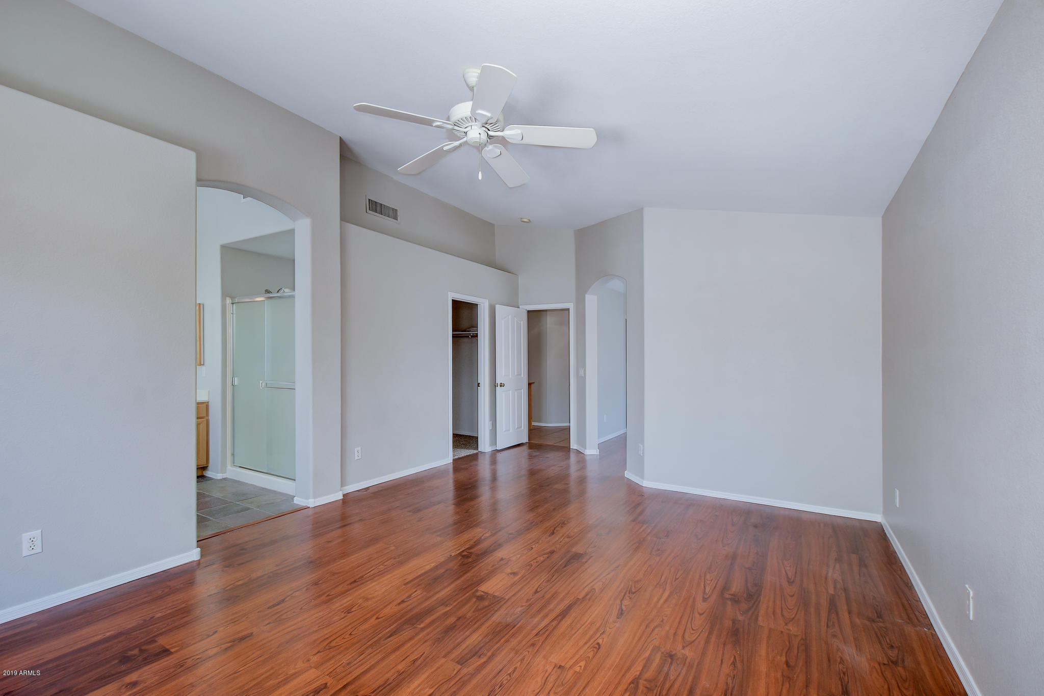 4404 East Rowel Road Phoenix, AZ 85050 - Photo 10 of 15 a view of an empty room with wooden floor