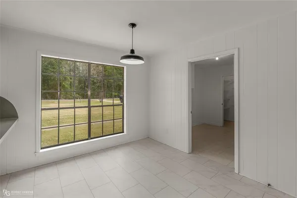 a view of empty room with windows