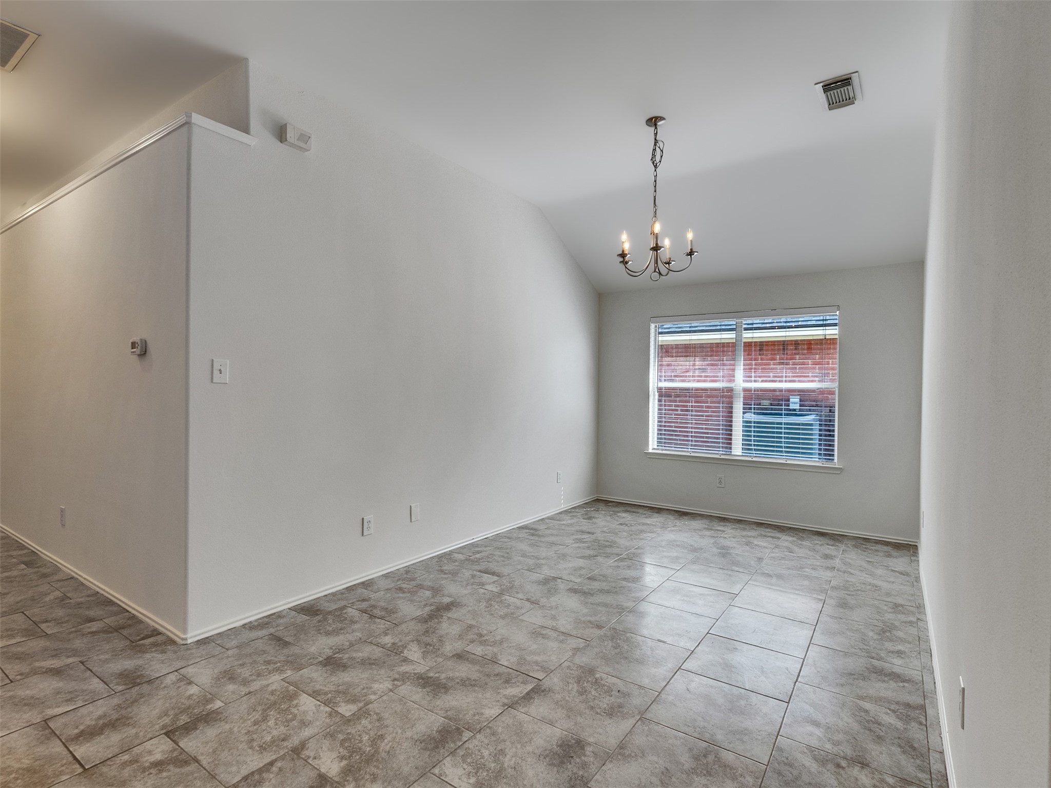 13431 Rural Oak Street Houston, TX 77034 - Photo 10 of 24 a view of an empty room with window and chandelier fan