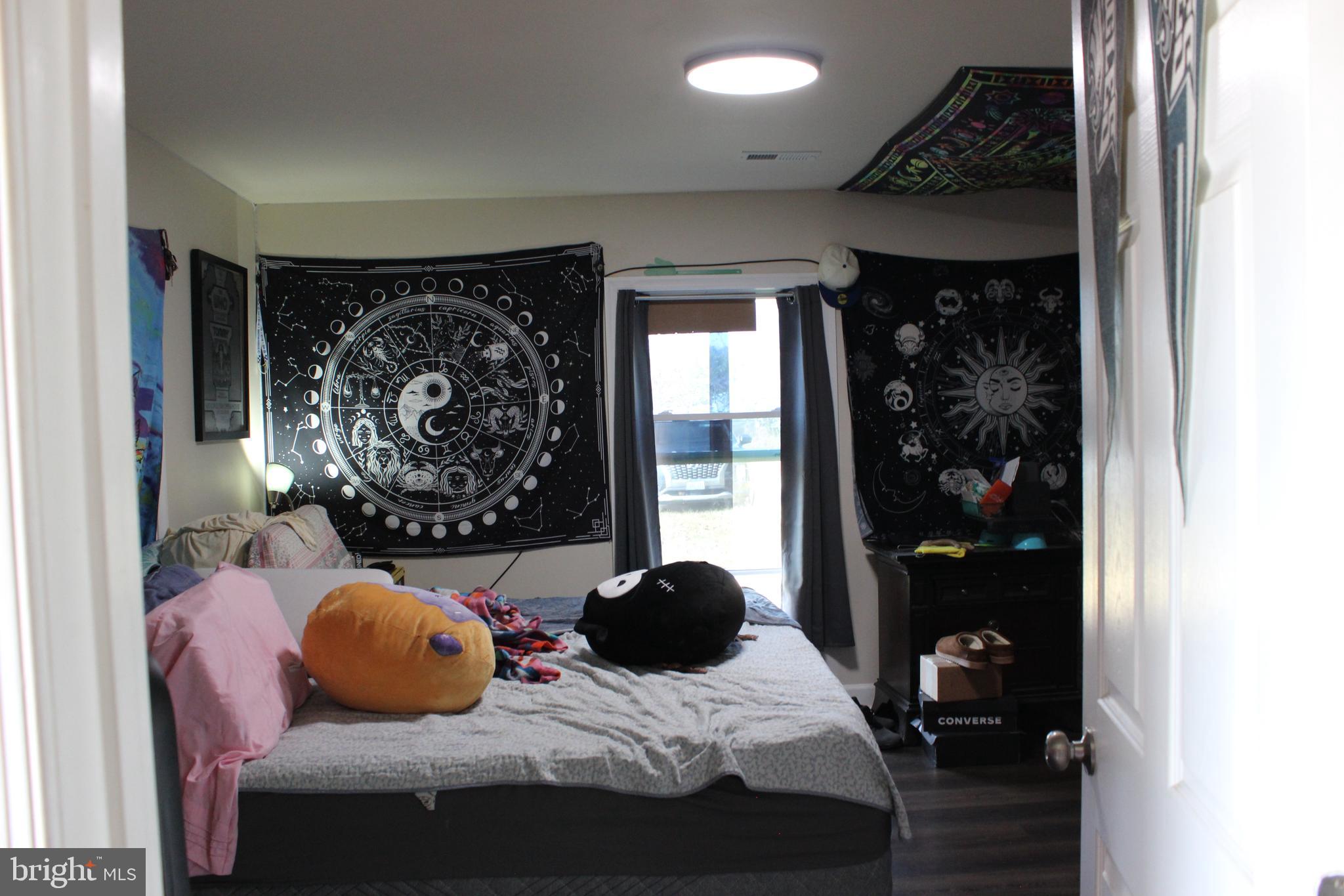 2740 Belsches Road Bumpass, VA 23024 - Photo 13 of 15 a bedroom with a bed dresser and window