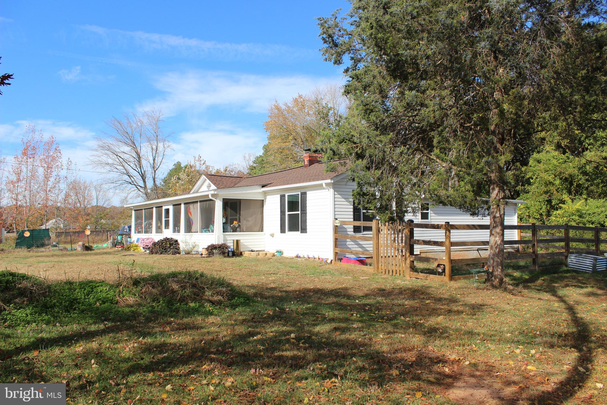 2740 Belsches Road Bumpass, VA 23024 - Photo 2 of 15 a front view of a house with garden