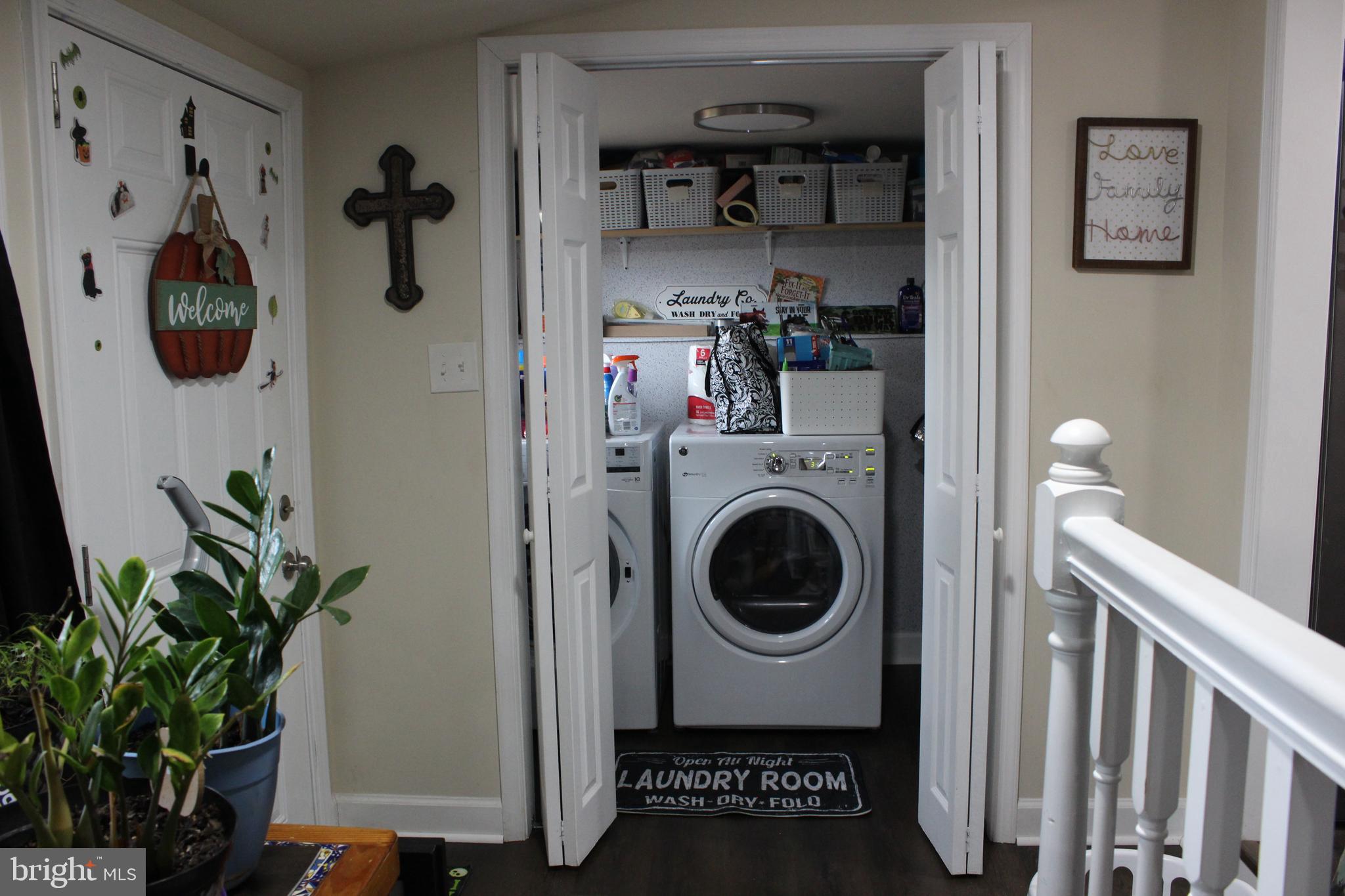 2740 Belsches Road Bumpass, VA 23024 - Photo 5 of 15 a view of a hallway with washer and dryer