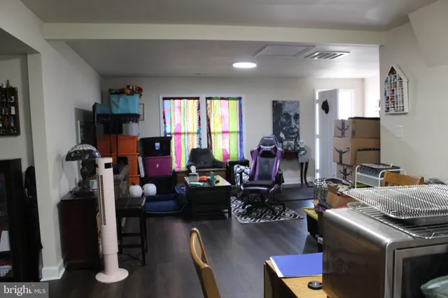 a room with furniture a rug and a window